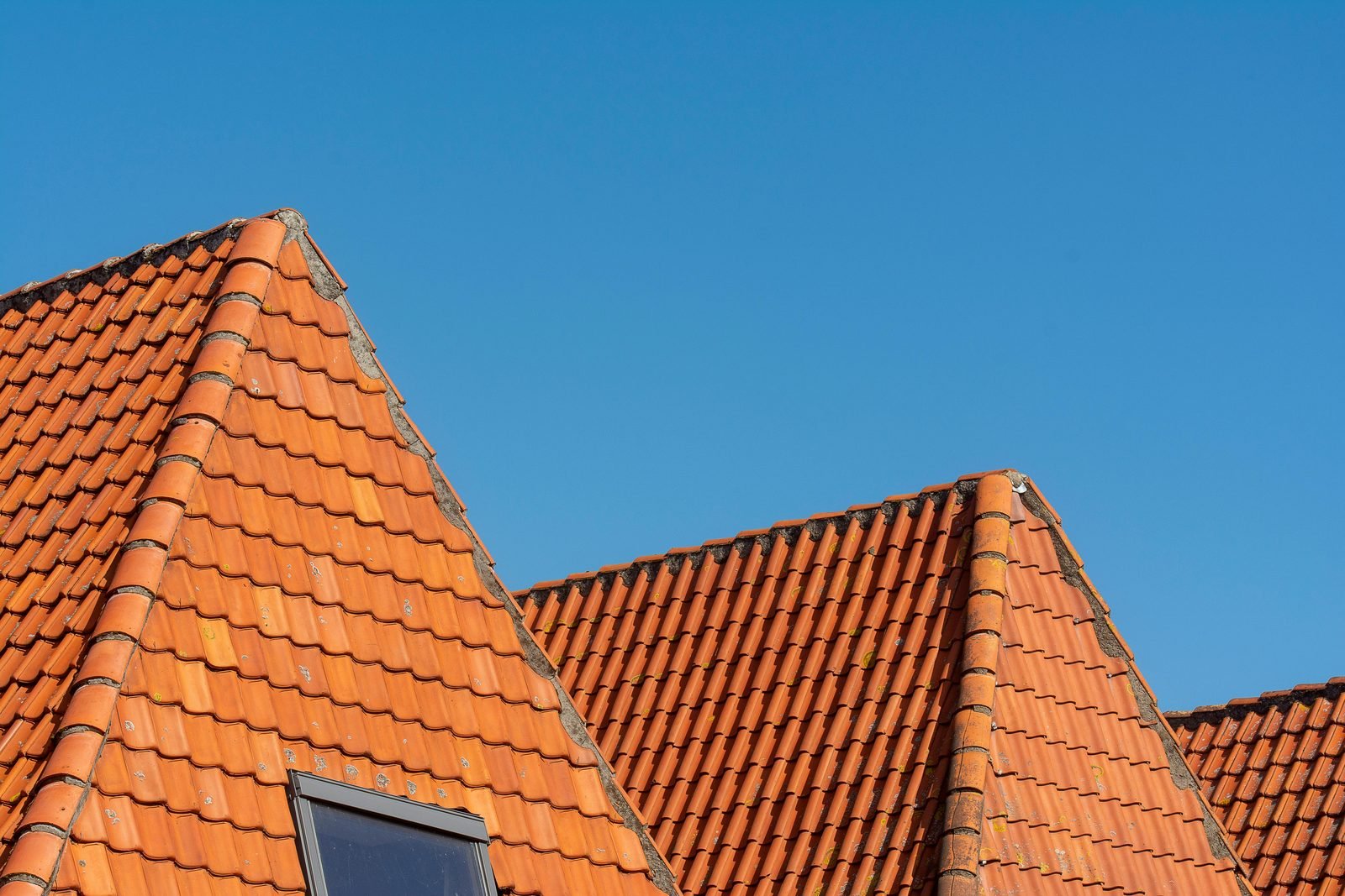 Bright orange clay tile gables